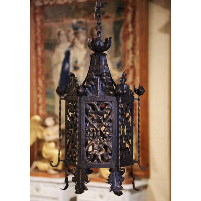 Crafted in France circa 1880, and hexagonal in shape with slant roof form top, the antique light fixture features pierced...