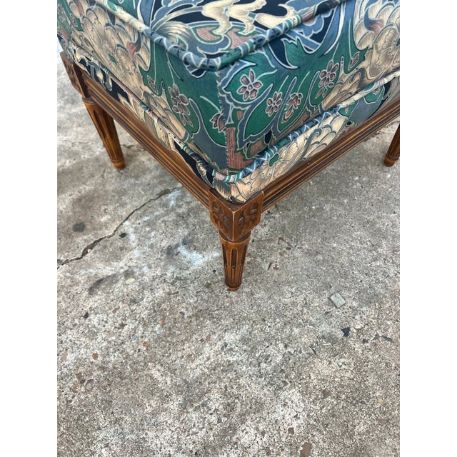 Elegant and timeless, this French 19th century Louis XVI stool is crafted from solid walnut and features beautifully...
