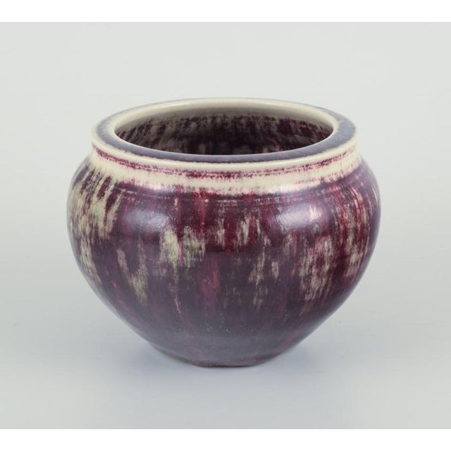 Rolf Fagerberg (1934-2008). Swedish ceramicist. Unique ceramic jar. Glaze in violet and sand colored tones. Late 20th...