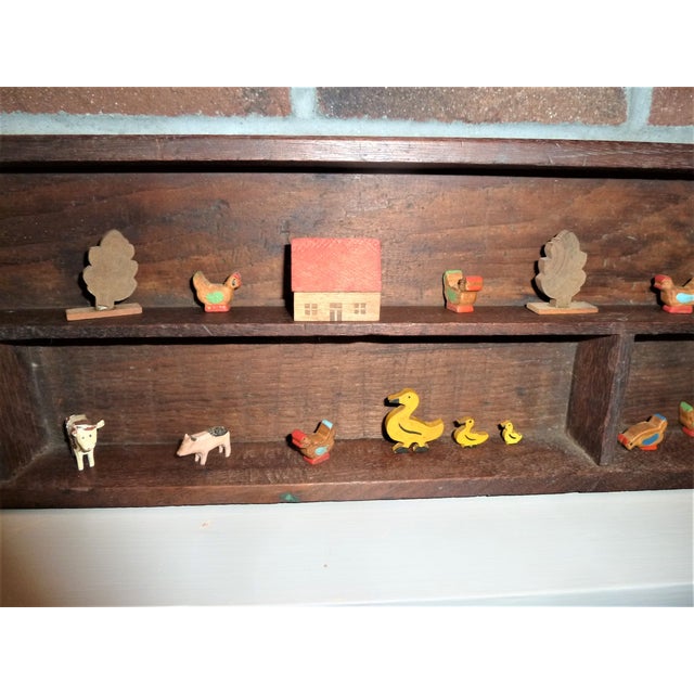 Rare miniature antique hand carved wood folk art farm animal grouping in a sturdy antique wall mounted display in good to...
