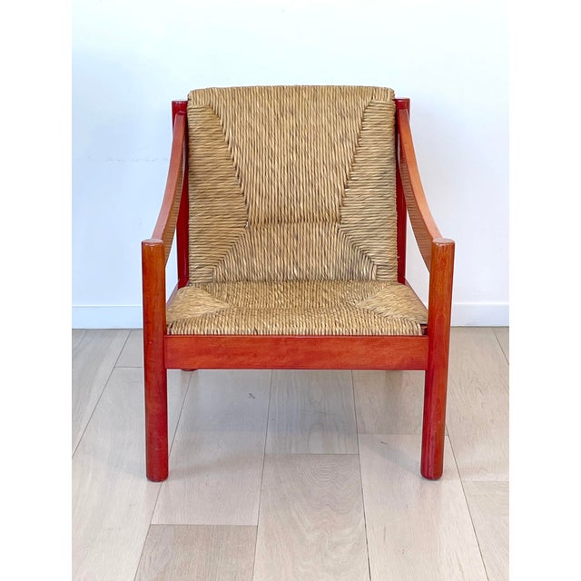 Carimate lounge chair by Vico Magistretti for Cassina, Italy, 1962. Stained solid beech red wooden frame with rush...