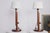 Vintage adjustable teak table lamps in the Scandinavian Mid-Century Modern style. Each lamp features a slim cylindrical...