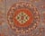 An antique Central Asian Khotan rug with asymmetrical central medallion amidst a field of flowers on a violet background,...