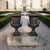 This pair of French cast iron Campana garden urns was produced in France during the Late 19th Century. Cast in heavy iron,...