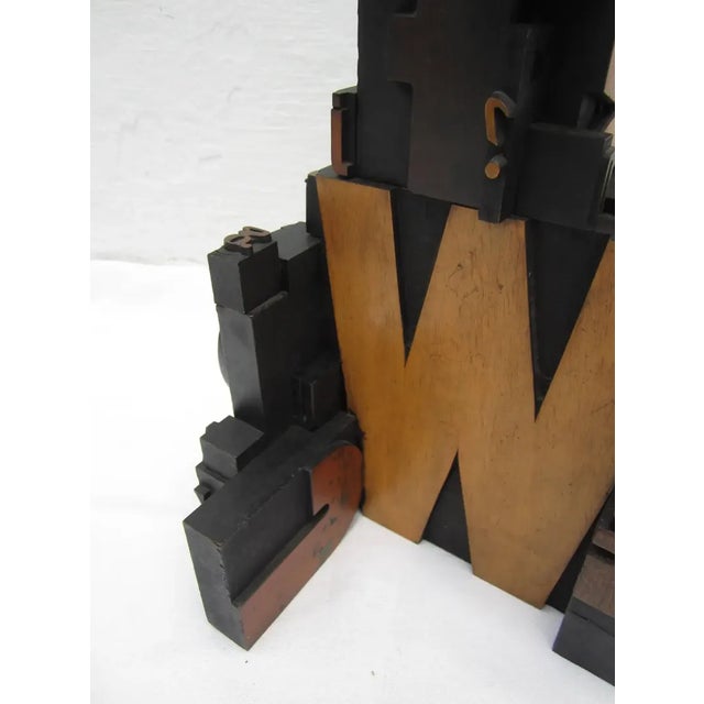 Antique letterpress printers wood block sculpture.