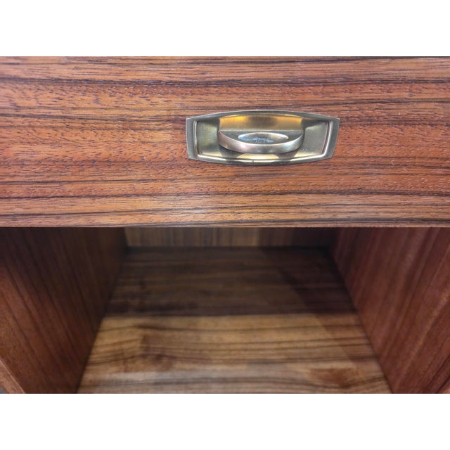 A very nice pair of Drexel Composite nightstands in Pecan Wood. These look almost new and are quite well made. Brass...