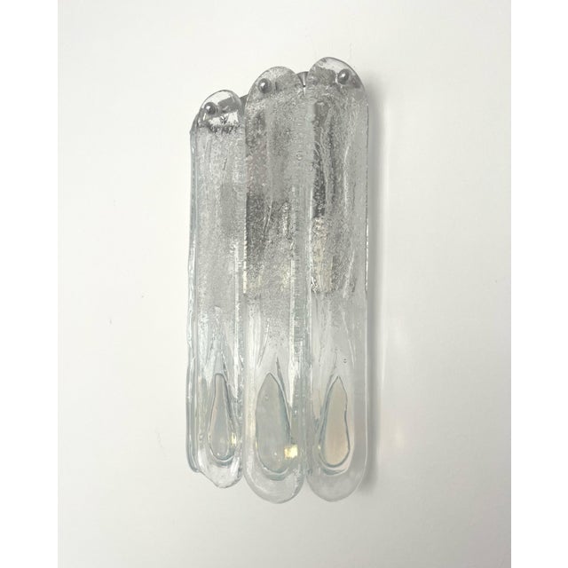 Marvelous and unique set of three italian iridescent murano glass wall sconces from 1970s. These fixtures were designed...