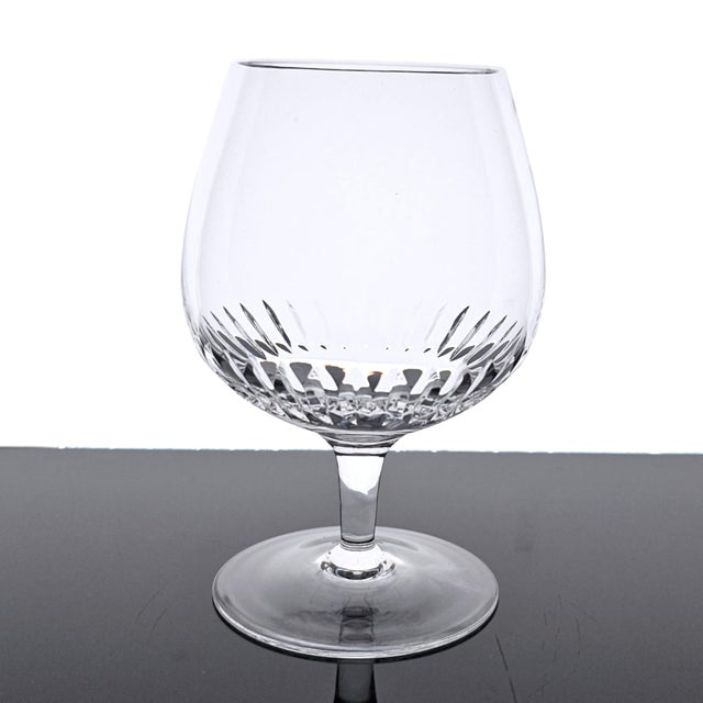 A matched set of four Rogaska Crystal brandy snifters, handcrafted in Slovenia circa 1995–2008. Each glass is formed in a...