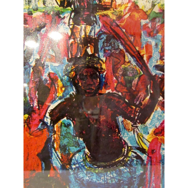 This colorful print reproduction of a dancing figure is held in a dazzling brass frame and glass cover. WEAR Minor wear to...