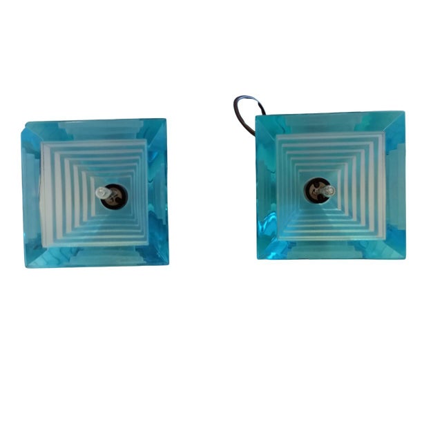 Two "Pyramid" pendant lamps (Italy) designed by Paolo Piva for Mazzega. Made of blue Murano glass, they have a simple...