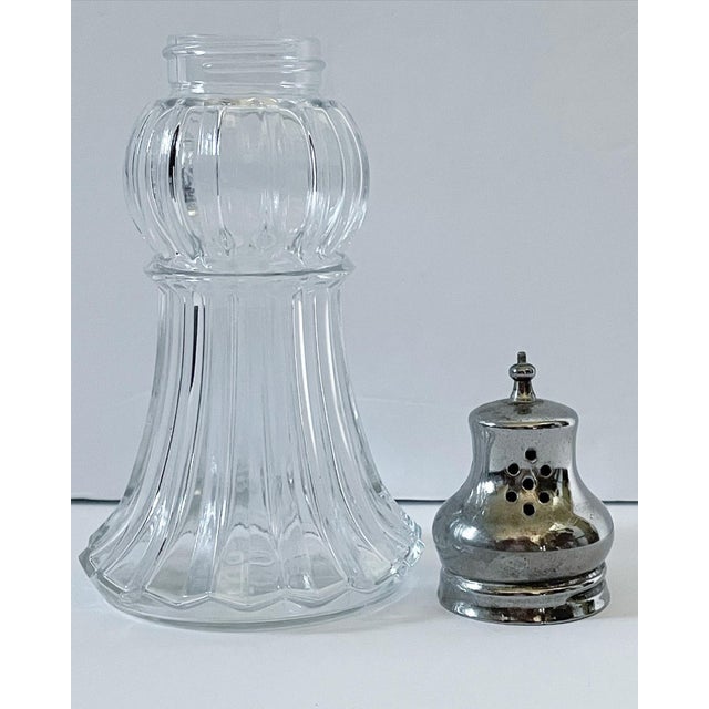 A lovely large vintage cut glass and silver plate shaker. This muffineer has such a great feminine shape and wonderful top...