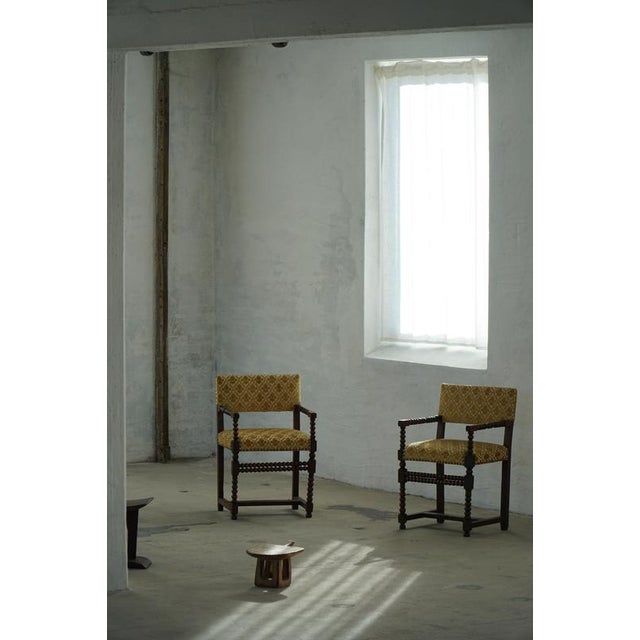 A classic Louis XIII-style armchair, crafted in the early 20th century, reflecting the robust elegance of 17th-century...