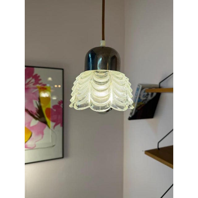 An East German design highlight from the Space Age era: This pendant lamp, model type 1545-02, from VEB Narva Leuchtenbau...