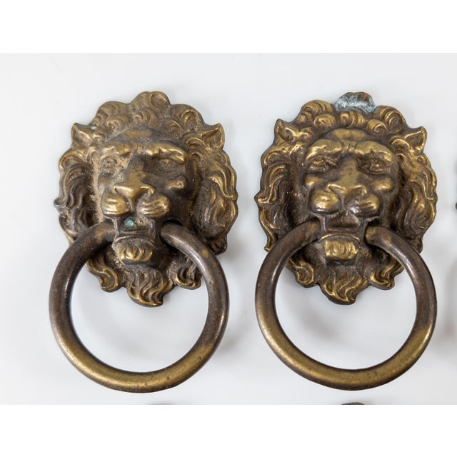 We are selling this great set of 8 20th century bronze or brass Lion’s head door pulls. The pulls have nice surface patina...
