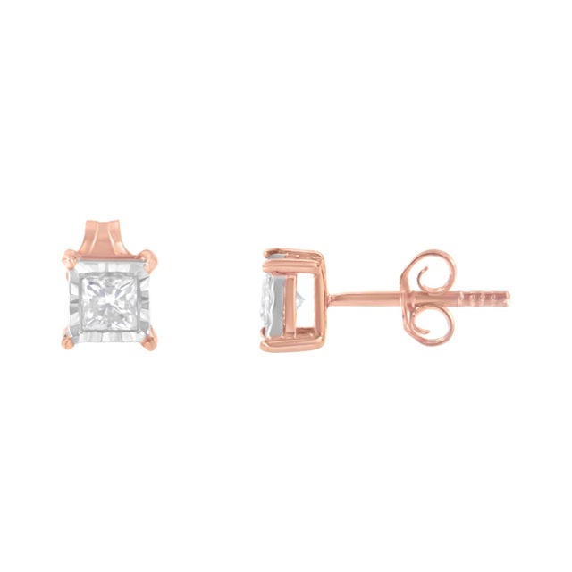 Shine like a diamond by wearing these elegant stud earrings. Fashioned in a square frame, these earrings are stunningly...