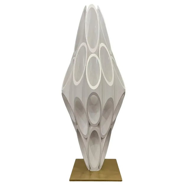 A modernist decorator accent lamp after Rougier or Panton. It consists of gel coated ABS with plastic tubes with a brass...