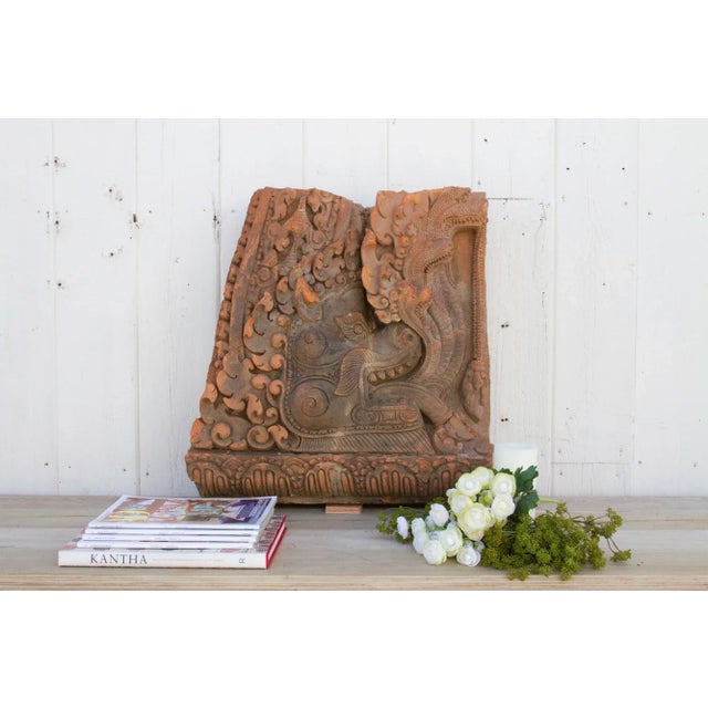 An impressive dragon statue wall carving made from terra-cotta and mounted on a custom Iron stand making it a beautiful...