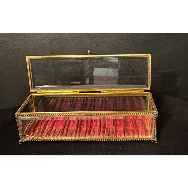 Gorgeous glass and ormolu-mounted rectangular box. Estimated date of late 1800s to early 1900s. This is a large gilt metal...