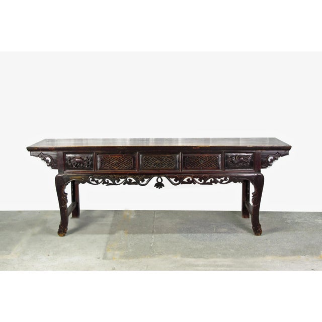 This magnificent antique Chinese console table was handcrafted with traditional joinery techniques and hand carved in late...