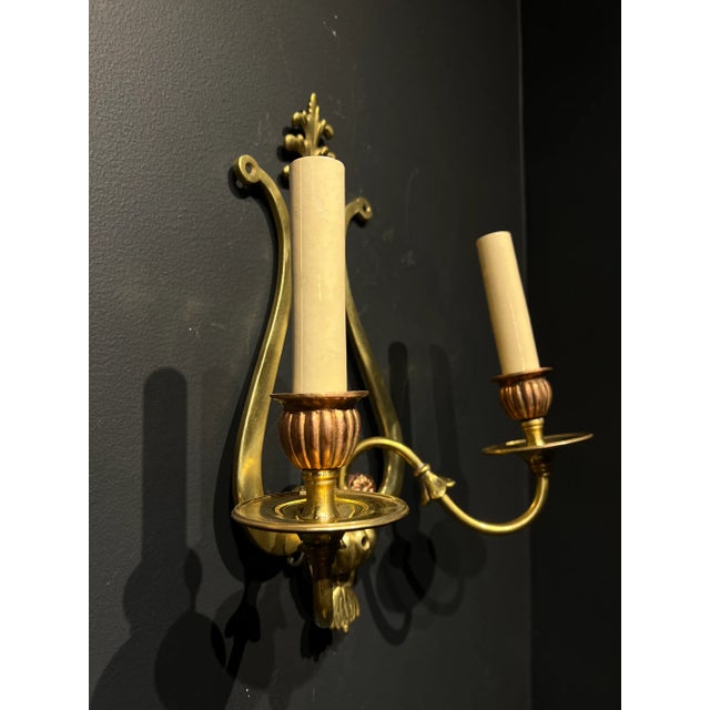 A pair of circa 1920’s Caldwell with Lyre shaped backplate