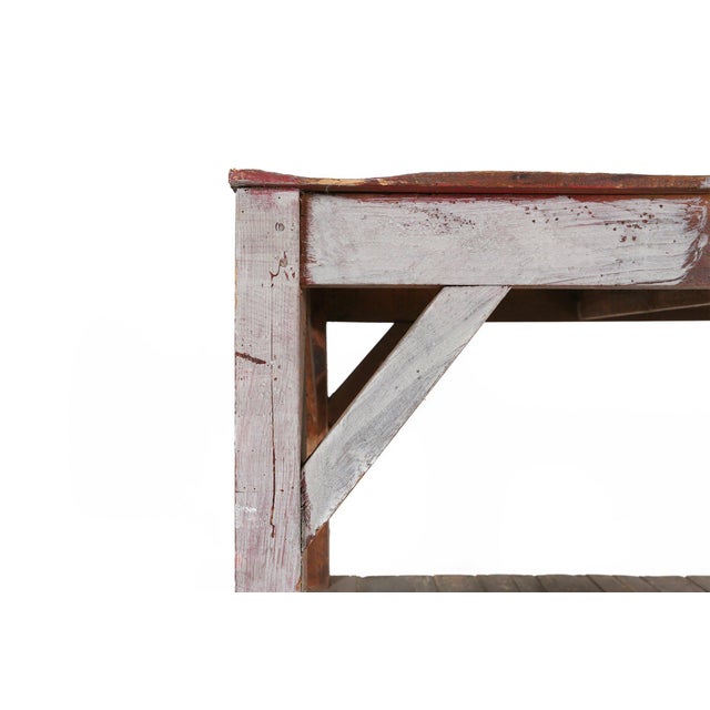 A robust vintage console table from France, dating to the early 1920s, crafted in solid wood with a handsome utilitarian...