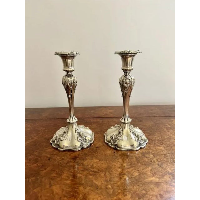 Quality pair of antique silver plated ornate candlesticks having a lovely ornate shaped candlestick standing on a ornate...