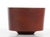 This handcrafted bowl is made of solid teak.