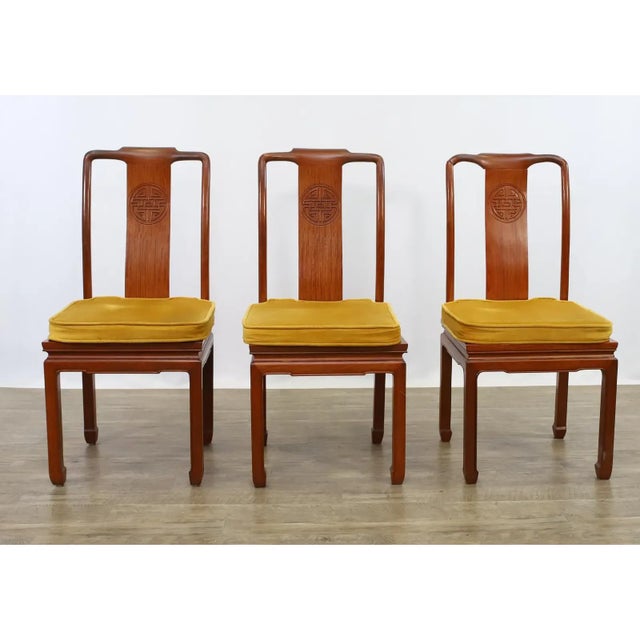This set includes eight matching chairs: two armchairs and six side chairs, each with traditional Chinese horseshoe backs...