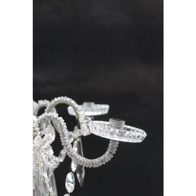 A magnificent chandelier, beaded, featuring almond-cut and square-cut crystals on the bands, pagoda-shaped elements...