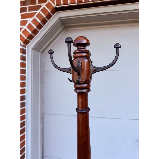Antique Turned Mahogany Coat & Hat Rack, Circa 1890-1910 A tall antique coat and hat rack in solid mahogany, dating to the...