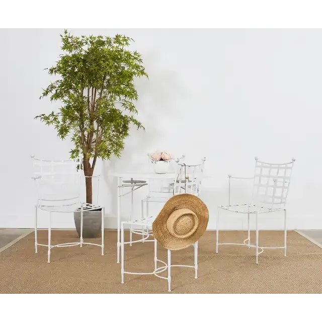 Iconic Mid-Century Modern set of four patio and garden dining chairs designed by Mario Papperzini for John Salterini. The...