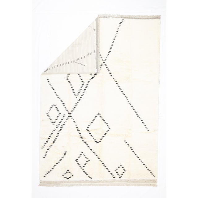 Fine Vintage Moroccan Wool Rug 8'6" x 11’7". Comprising both the nomadic Berber rugs of the Atlas Mountains, with very...