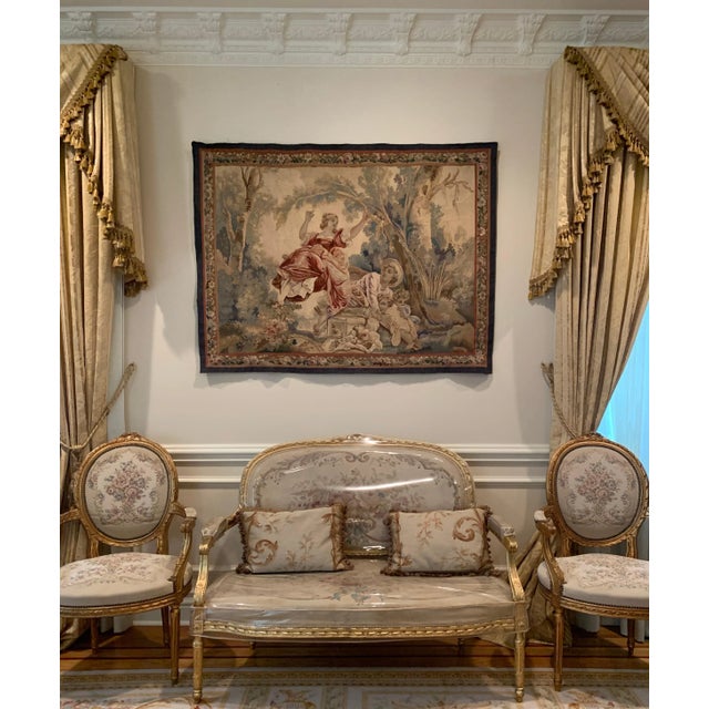This is a lovely antique 19th century square French Aubusson tapestry depicting a on a beautiful spring day in the...