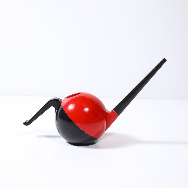 This striking Mid-Century Modernist watering can represents the quintessential blend of form and function, embodying the...