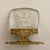 These vintage place card holders feature clear intaglio-carved glass inserts depicting dancing figures mounted on ornate...