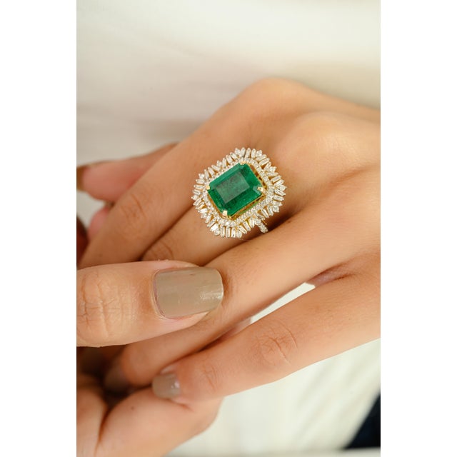 Command attention with this show-stopping 14K gold emerald and diamond cocktail ring, featuring a breathtaking 4.83 carat...