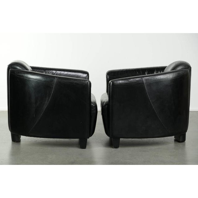 This lovely set of two black cowhide Aviator-style armchairs has a beautiful look. The armchair is a stylish and timeless...