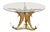 A fine French circular cocktail or coffee low table featuring a round glass top set upon a sculptural base of polished...