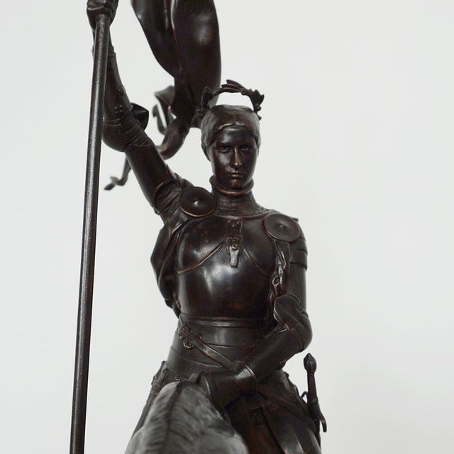 A late 19th century bronze sculpture depicting jeanne d'arc. A stunning early salon version of the famous joan of arc in...