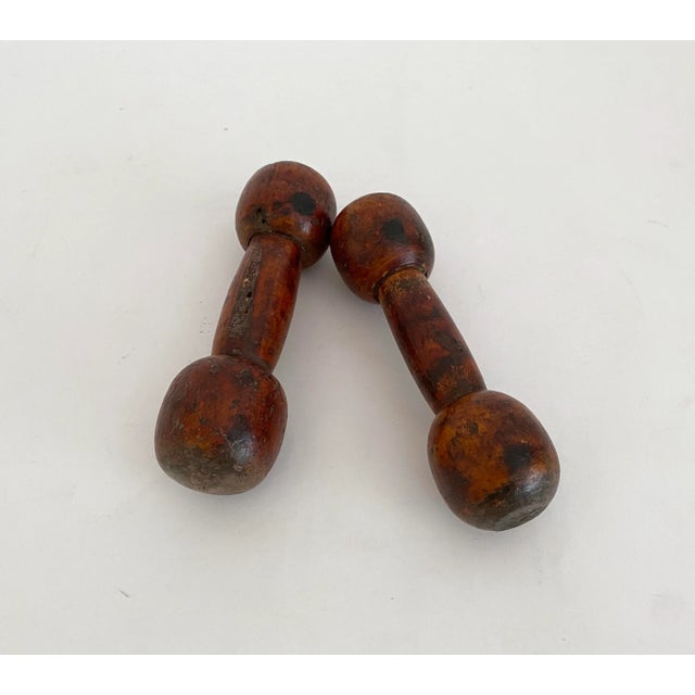 Pair of early 1900s wood dumbbells with extraordinary patina and color. Likely better for display than a workout given...