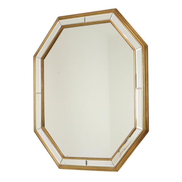A fantastic octagonal Deknudt mirror featuring beveled surrounding mirror panels; executed in the Hollywood Regency style,...