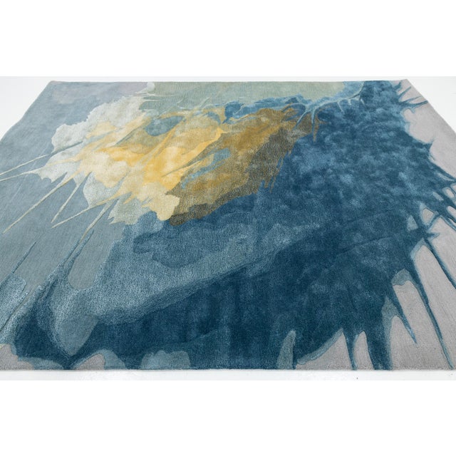 Elevate your living space with this striking Modern Hand-Tufted wool and viscose Rug, featuring a dramatic, expressive...