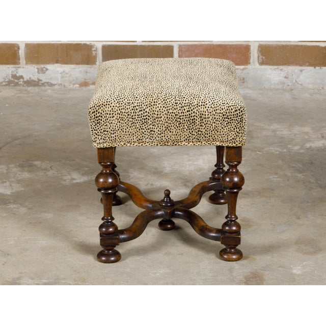 An English William and Mary style stool from circa 1900 with turned legs, curving X-Form stretcher, bun feet and...