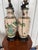 Pair of vintage Chinese Crackle porcelain vase lamps on black wooden bases. Each lamp measure 39.5" to tip of finial....