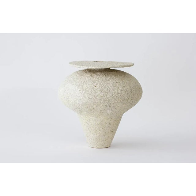 "Isolated n.19" stoneware vase by Raquel Vidal and Pedro Paz Dimensions: 23.5 x 23 cm Materials: Hand sculpted and glazed...