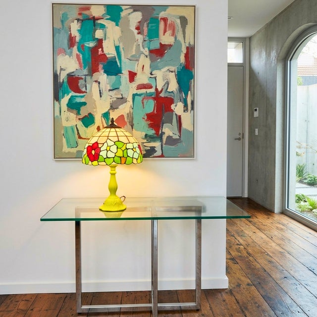This piece is an intentional color study—a playful, high-contrast accent designed to anchor a neutral space with a jolt of...