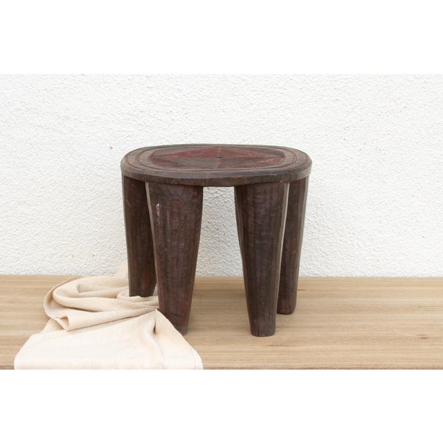A unique piece of African art, this vintage Nupe table from Nigeria is a must-have for collectors and enthusiasts of Nupe...
