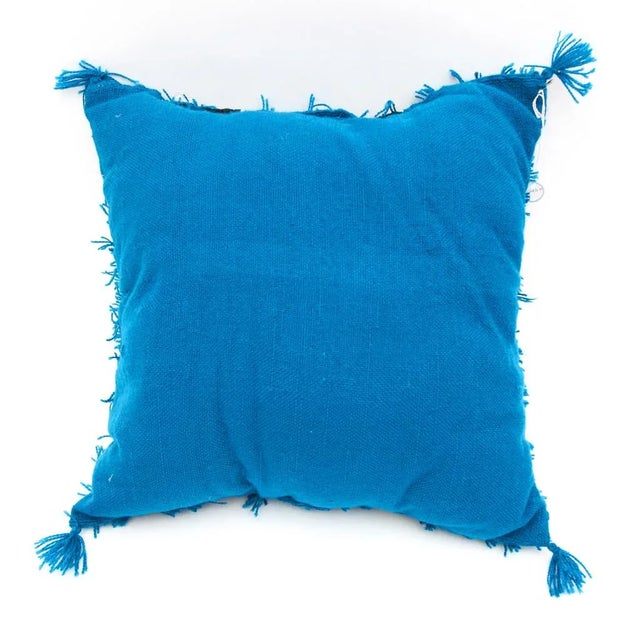 Hand-woven by Berber women in the Azilal region of Morocco, this Moroccan Turquois Wedding Pillow is composed in the...