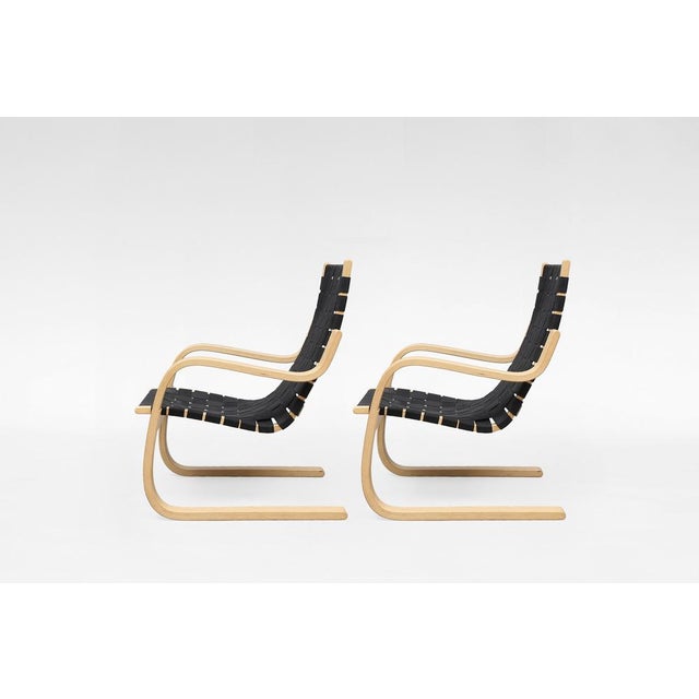 A vintage Alvar Aalto armchair for Artek, designed in Finland during the early Scandinavian modern period. Defined by its...