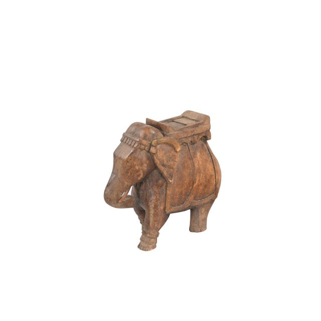 This Vintage Indian Carved Teakwood Elephant Statue is a wonderful example of Indian folk art, handcrafted from natural...